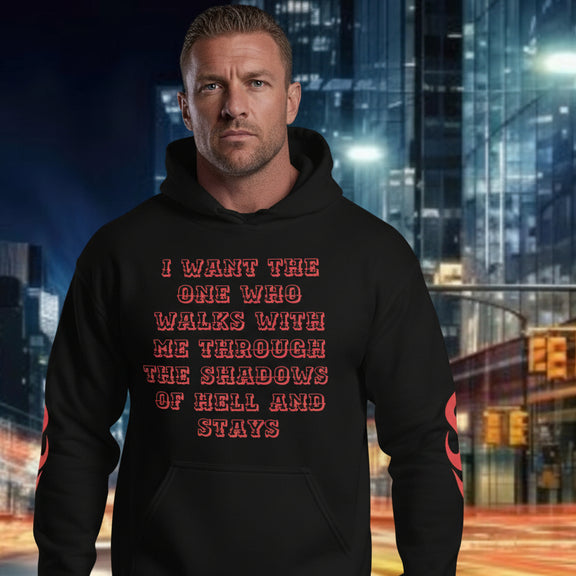 Model wearing oversized streetwear hoodie with graphic text about loyalty and commitment.
