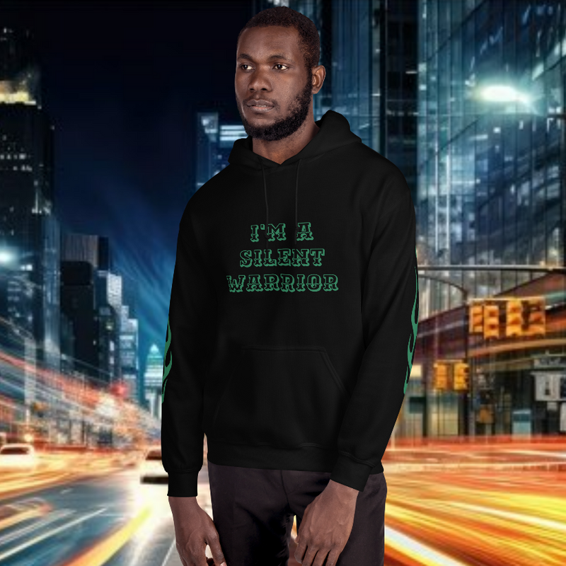 Model wearing oversized streetwear hoodie "warrior" with text "I'M A SILENT WARRIOR" in an urban night setting.
