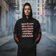 Oversized streetwear Hoodie "you will never" worn by a model in an urban setting, emphasizing individuality and confidence.