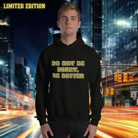 oversized streetwear hoodie 'be better' worn by a model in an urban setting with bright city lights.