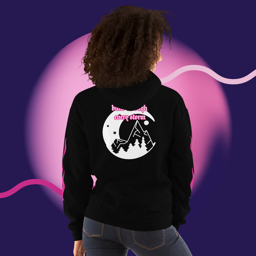 Model wearing oversized streetwear hoodie 444 featuring mountain and moon design on back.