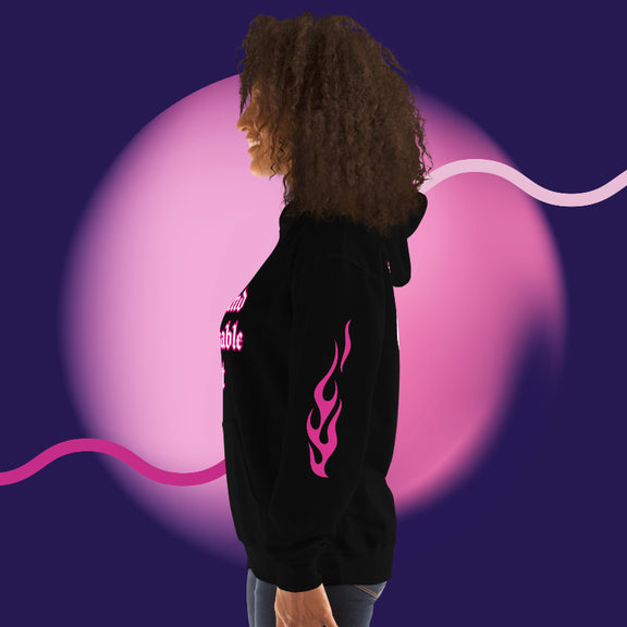 Woman wearing an oversized streetwear hoodie 444 with flame design on sleeve, set against a colorful background.