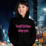 Oversized streetwear hoodie with bold text 'don't let fear stop you', perfect for confident fashion statements.
