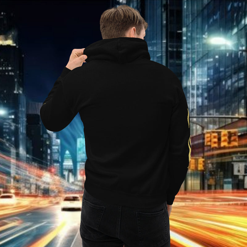 Back view of a model wearing an oversized streetwear hoodie in an urban setting with blurred city lights.