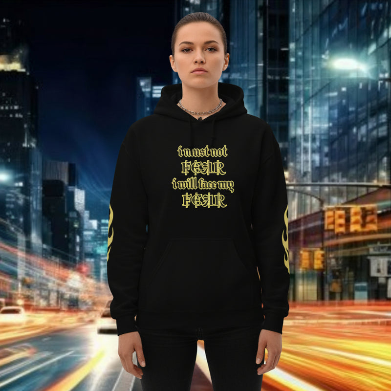 Oversized streetwear hoodie with 'I must not fear. I will face my fear' mantra in a city at night.
