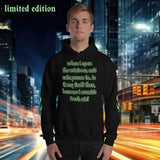 Oversized streetwear hoodie in black featuring green text design, limited edition, capturing a rainy city vibe.