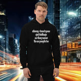 Man wearing oversized streetwear hoodie featuring the quote about trusting gut feelings.