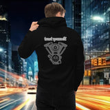 Oversized streetwear hoodie featuring 'trust yourself' design on the back, set against a city backdrop.