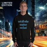 Model wearing oversized streetwear hoodie "wander" against a city backdrop, showcasing its street style fashion.