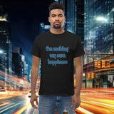 Model wearing an oversized streetwear t-shirt featuring the phrase 'I'm making my own happiness' in a city backdrop.